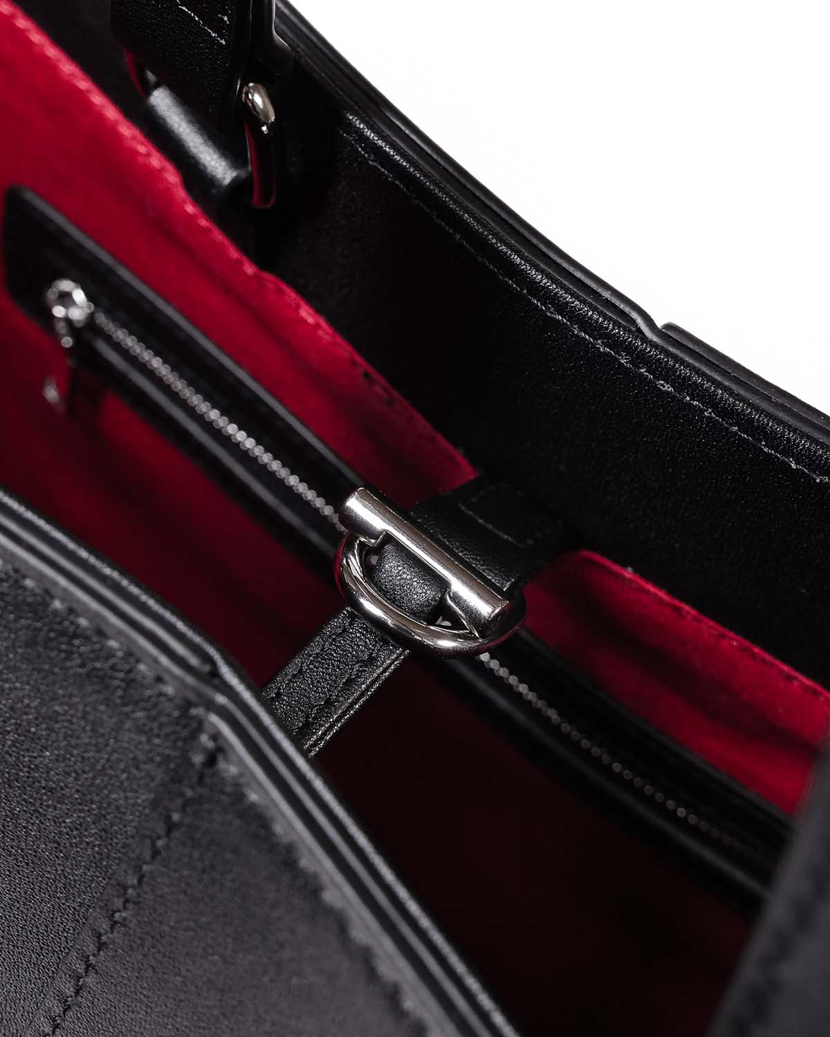 Close up of silver hardware and toggle closure