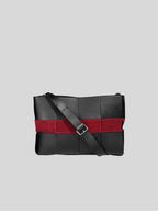 Reed woven bag front view with crossbody strap