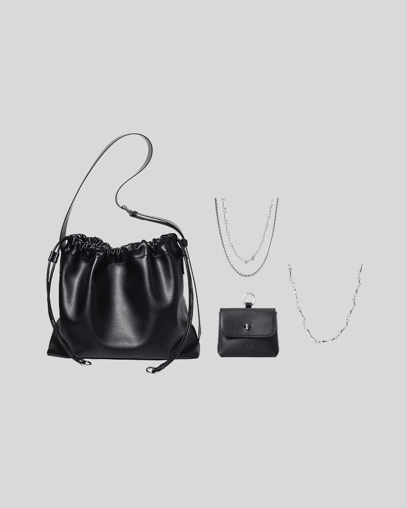 Black Sage Bag bundle featuring the black Sage Bag, black Finlay Mini Bag Charm, Annick necklace and Riptide necklace