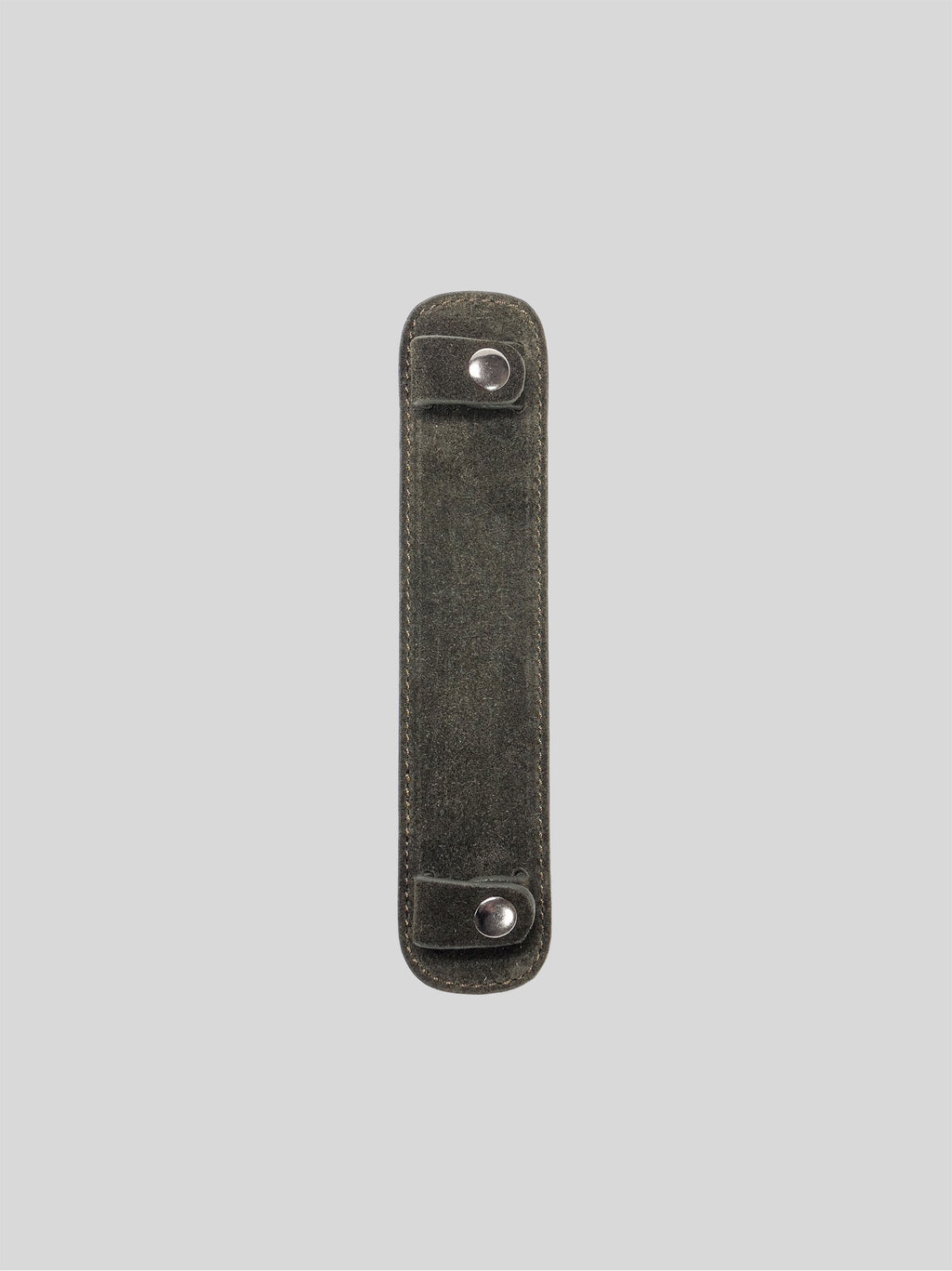 Forest suede shoulder pad on a grey background