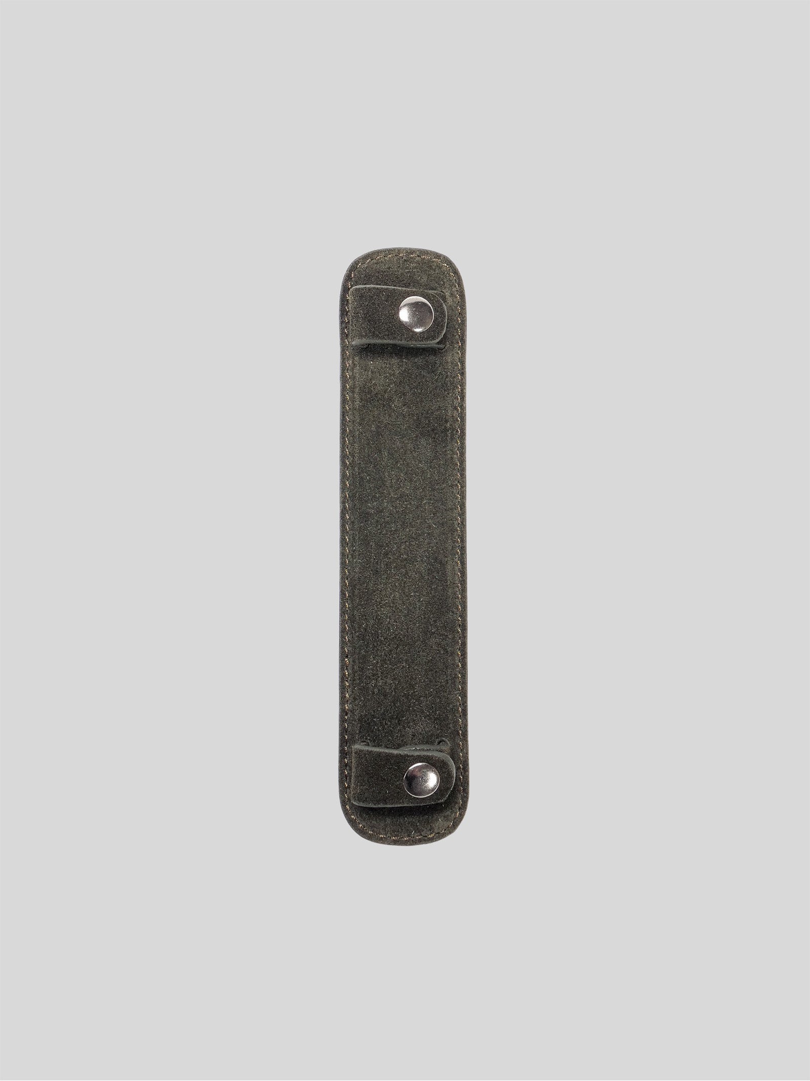 Forest suede shoulder pad on a grey background