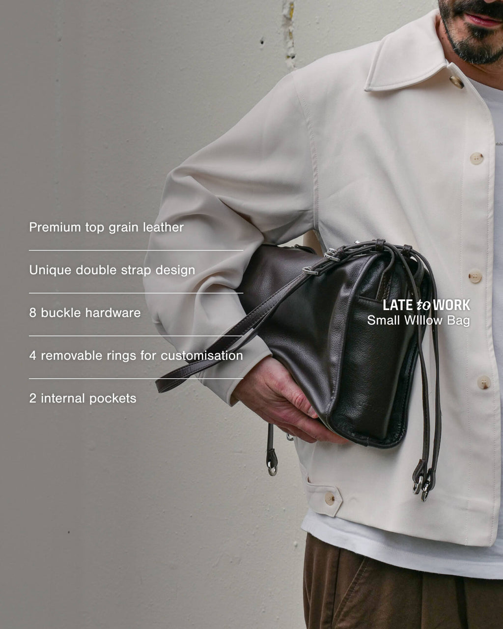 Small brown Willow Bag with product features overlay: premium top grain leather, unique double strap design, 8 buckle hardware, 4 removable rings for customisation, 2 internal pockets