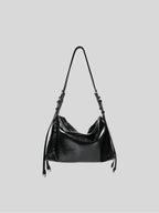 Small black Willow Bag on a plain grey background