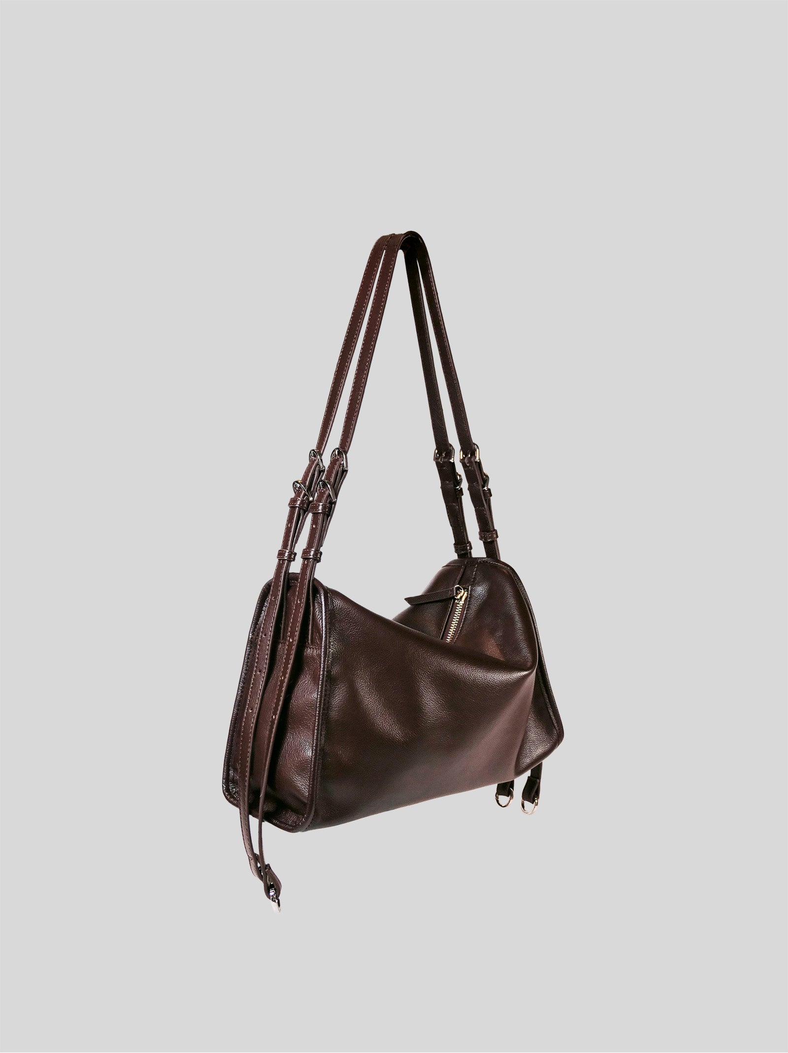Small brown Willow Bag 45 degrees on a plain grey background