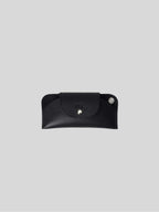Top-grain leather sunglasses case on a light background 