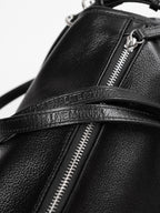 Close up of 'Late to Work' embossed on Willow Bag's double straps