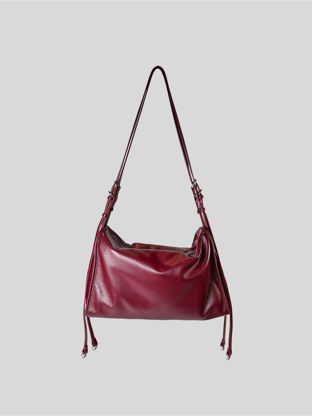 Top grain burgundy Willow Bag isolated on a grey background