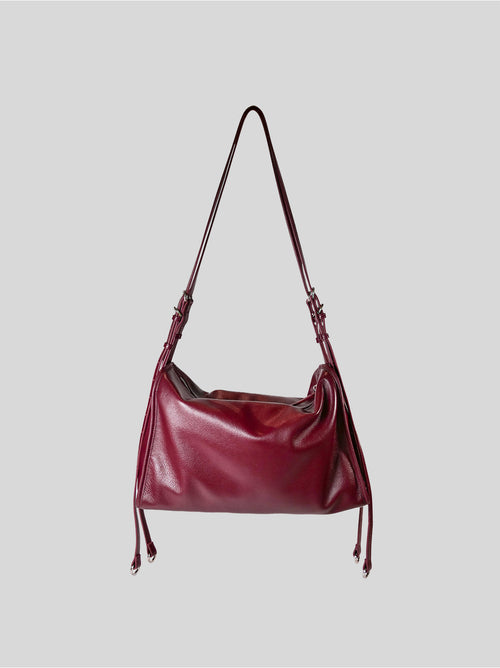 Top grain burgundy Willow Bag isolated on a grey background