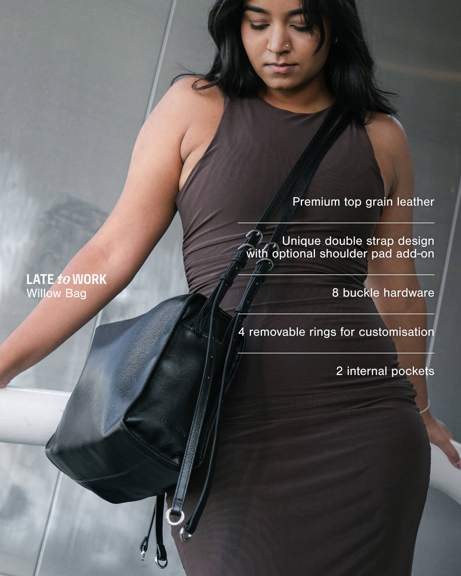 Woman carrying black Willow Bag with product features listed on the screen: premium top-grain leather, unique double strap design, 8 buckle hardware, 4 removable rings and 2 internal pockets