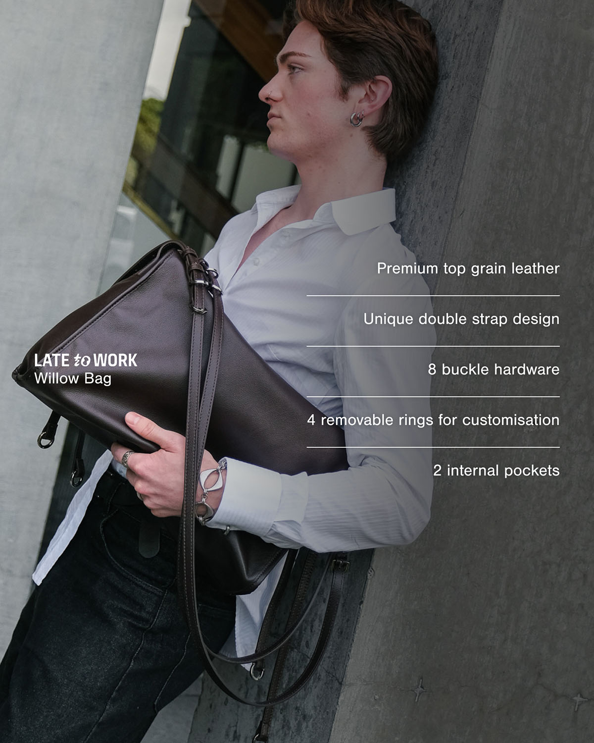 Man carrying brown Willow Bag with product features listed on the screen: premium top-grain leather, unique double strap design, 8 buckle hardware, 4 removable rings and 2 internal pockets