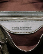 Close up of interior zipped pocket with 'Late to Work' embossed inside